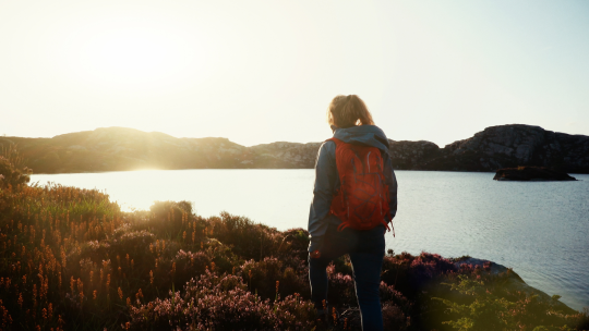 Girl outdoors overlooking a lake
