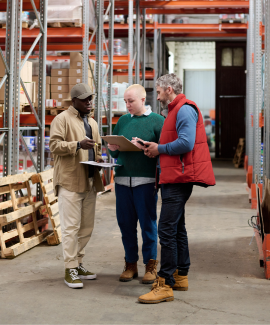 Team meeting in warehouse