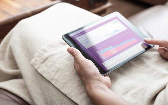 Person using MinPension app on device, easy retirement planning