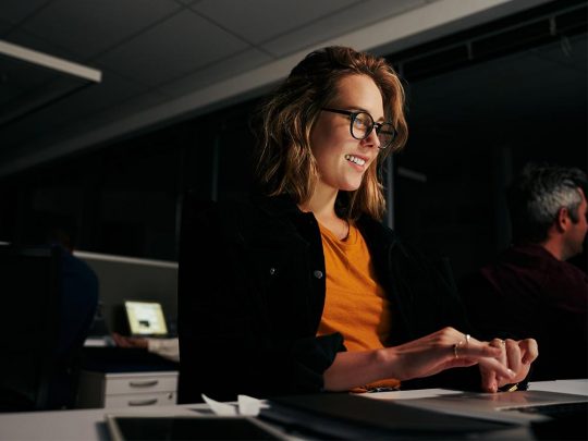 woman typing on laptop